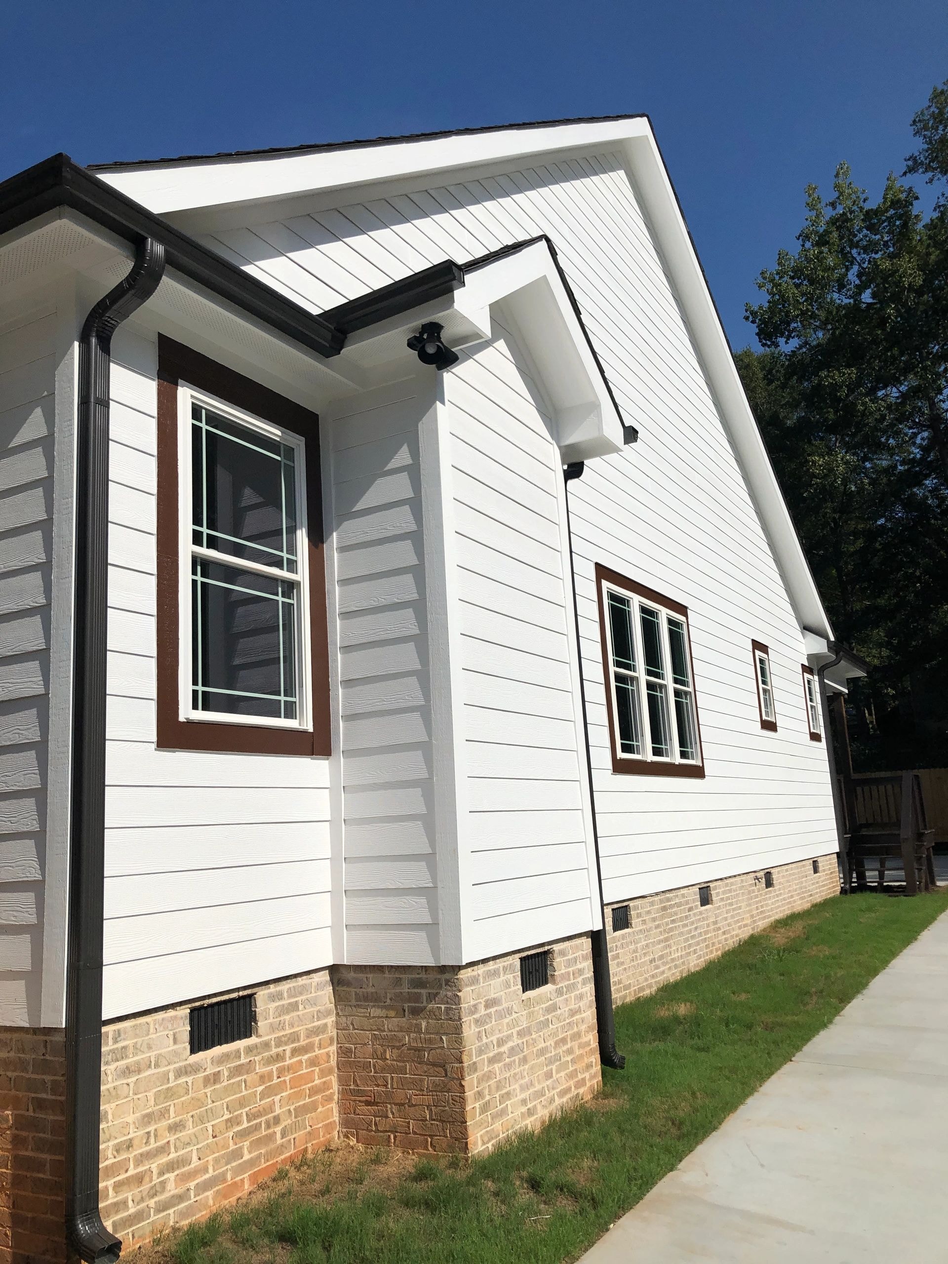Modern white house with brick foundation